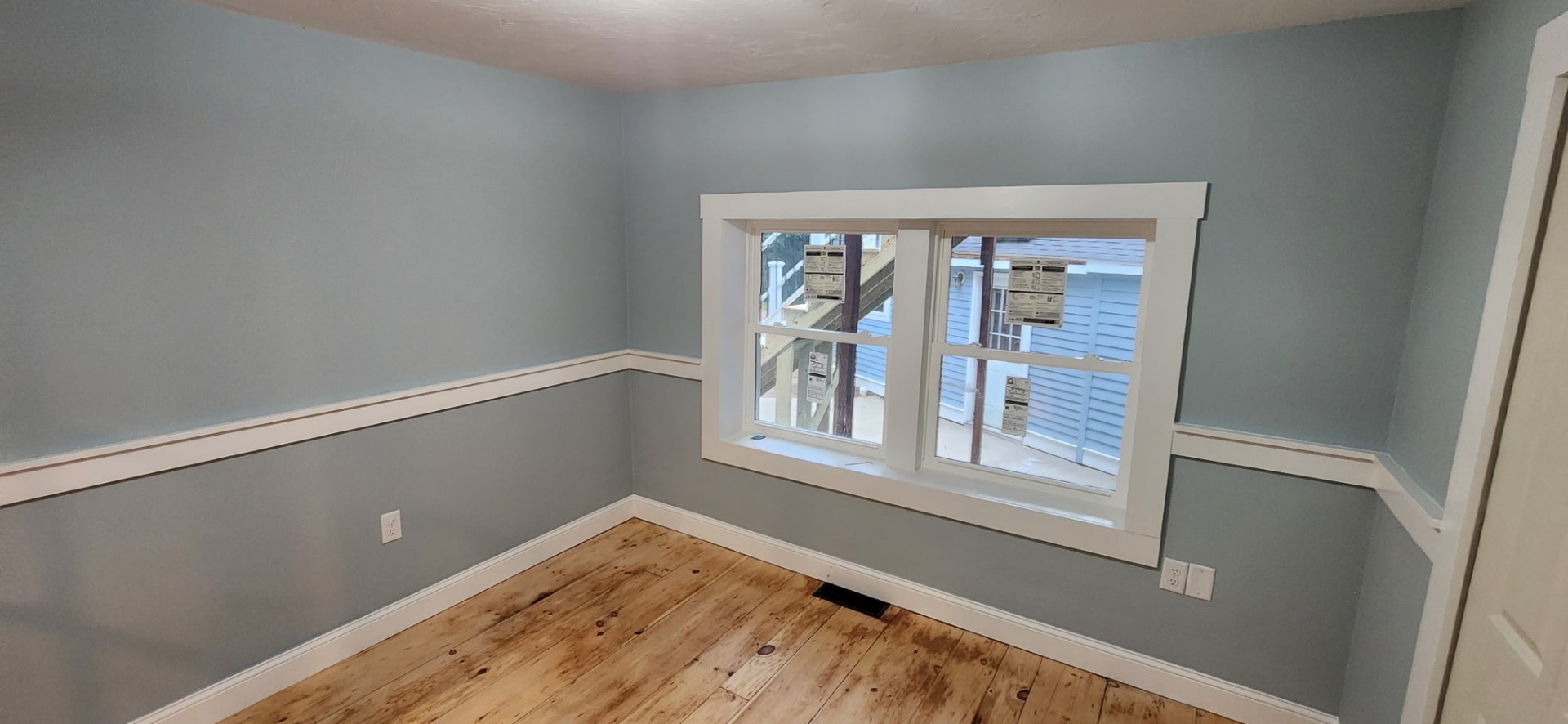 Coastal blue interior with chair rail and freshly painted trim, Marshfield MA
