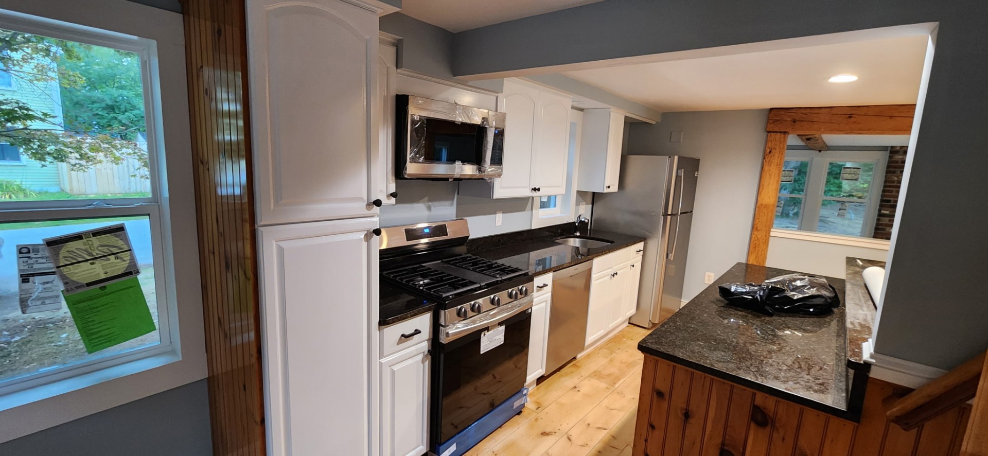 Refinished white kitchen cabinets with granite counters, South Shore MA